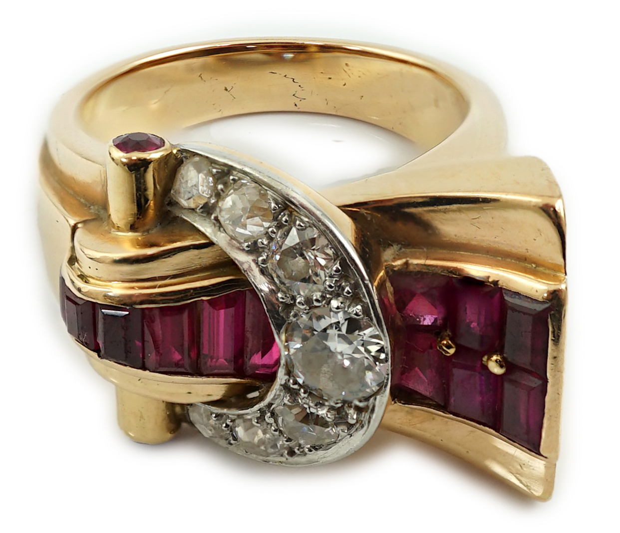 A 1950's continental gold, synthetic ruby, round and rose cut diamond cluster set fan shaped 'buckle' cocktail ring
